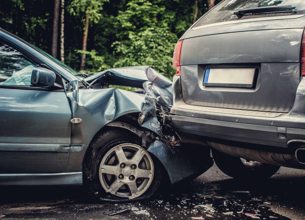 Close up smached cars on a road.